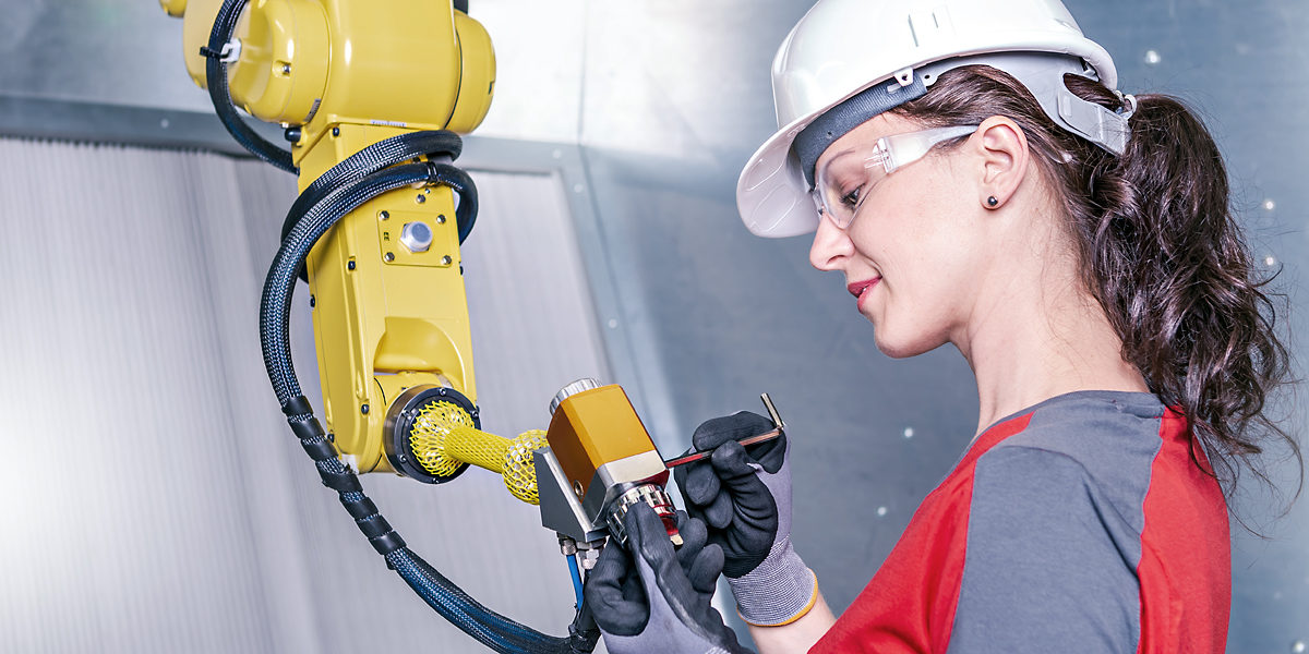 A young female technician while machine constructing in a manufacturing plant Schlagwort(e): automation, checking, construction, consultant, contractor, control, digital, engineer, engineering, engineers, equipment, factory, female, germany, hardhat, industrial, industry, machine, machine constructing, machinery, maintenance, manufacture, manufacturing, manufacturing plant, mechanic, mechanical, metal, occupation, person, planning, plans, plant, production, protective, robot, robotic, robotic arm, safety, service, steel, support, technician, technology, woman, work, worker, working, automation, checking, construction, consultant, contractor, control, digital, engineer, engineering, engineers, equipment, factory, female, germany, hardhat, industrial, industry, machine, machine constructing, machinery, maintenance, manufacture, manufacturing, manufacturing plant, mechanic, mechanical, metal, occupation, person, planning, plans, plant, production, protective, robot, robotic, robotic arm, safety, service, steel, support, technician, technology, woman, work, worker, working, cobot, coboter, Messe, Online, Online-Messe, Kollege, Roboter